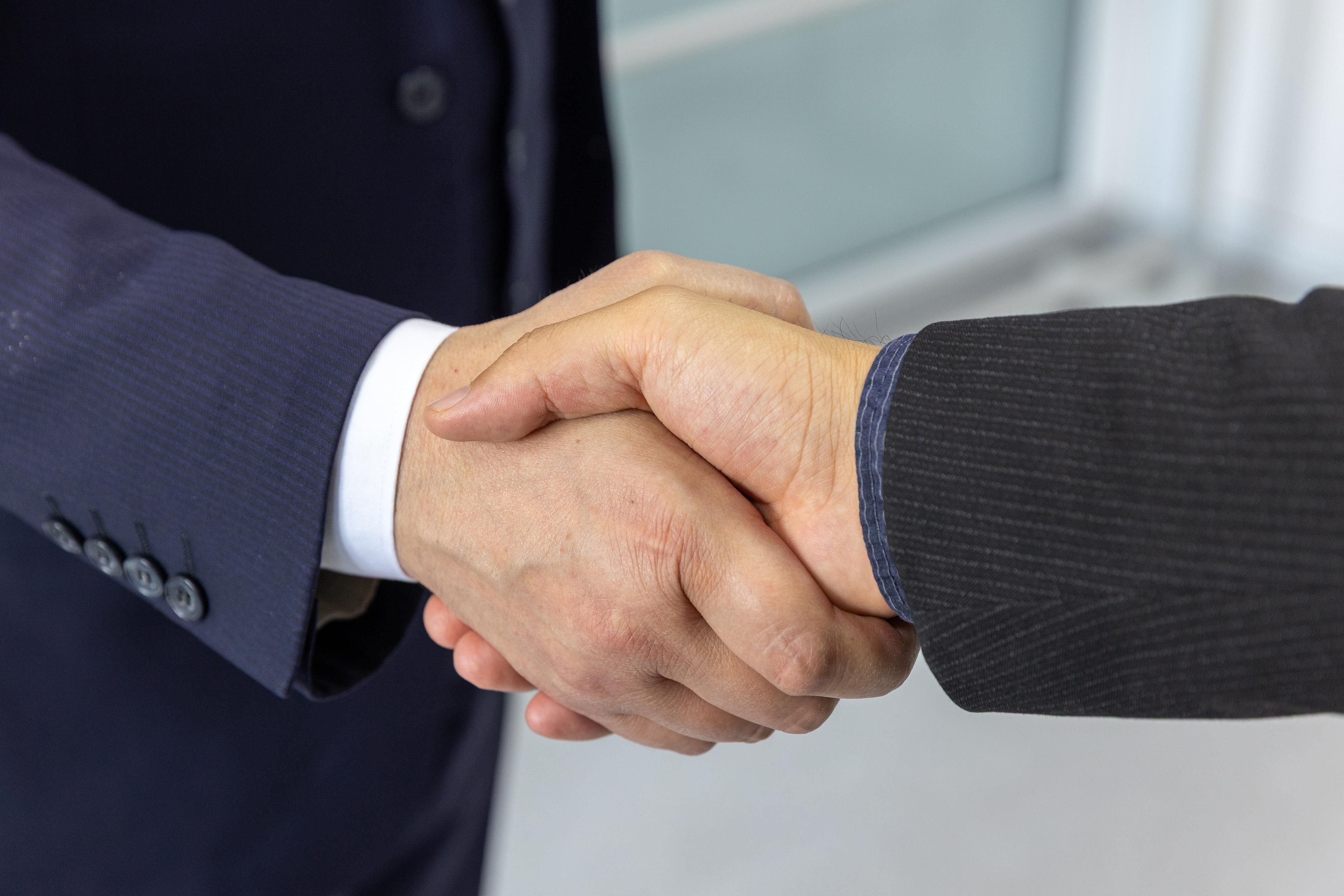 Business handshake sealing an agreement